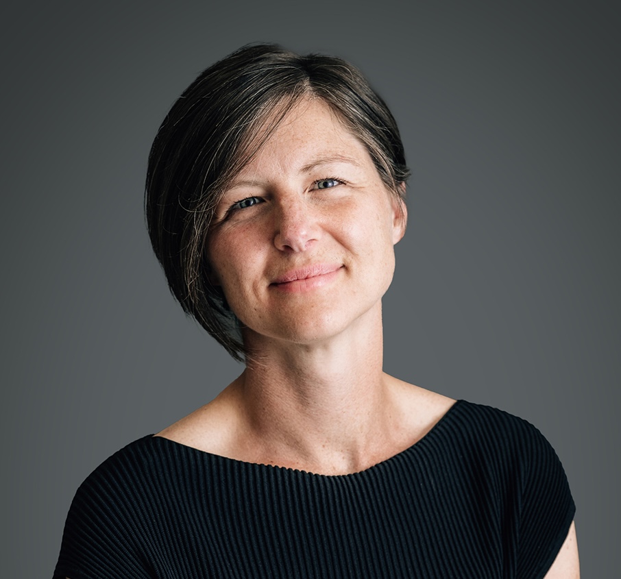 Profile headshot of Dr Alice Miller wearing a black t-shirt